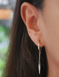 earrings, silver earrings, jewelry, statement earrings, accessories, fashion jewelry, cool earrings, trending jewelry, Trending on tik tok, fine jewelry, christmas gifts, birthday gifts, anniversary gifts, dangly earrings, earrings with a bullet, earrings with a spike, dagger jewelry, cool silver jewelry, small hoop earrings for men, spike earrings, spike hoop earrings, bullet earrings, sterling silver bullet earrings, jewelry in Miami, shopping in Brickell, jewelry store in Brickell, jewelry store in Miami