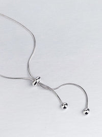 silver necklaces, silver necklace, lariat necklace, 925 sterling silver necklaces, fashion jewelry, dainty long necklaces, waterproof necklaces, fashion jewelry, fine jewelry, david yurman necklaces, tarnish free jewelry, trending accessories, white gold necklaces, necklaces for low cut dress, necklaces for low cut shirts, plain silver necklaces, chokers, long necklaces, 18 in necklace, 16 inch necklaces, adjustable necklaces, long choker necklaces
