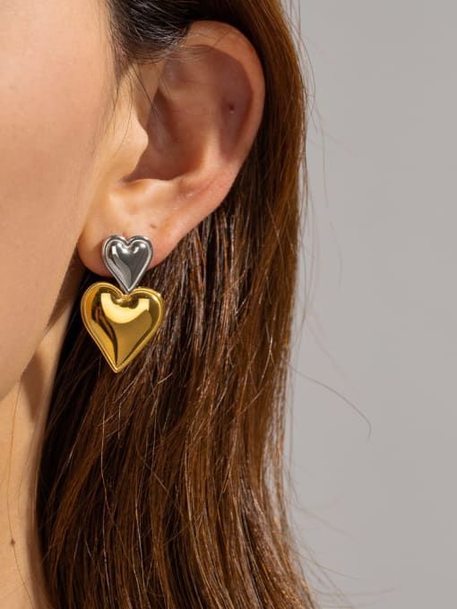 earrings, big earrings, heart earrings, silver and gold two tone earrings, statement earrings, dangle earrings, dangle heart earrings, double heart earrings, designer jewelry, jewelry sales, jewelry with hearts, chunky jewelry, chunky earrings, kesley jewelry, statement jewelry, plain big earrings, cool earrings