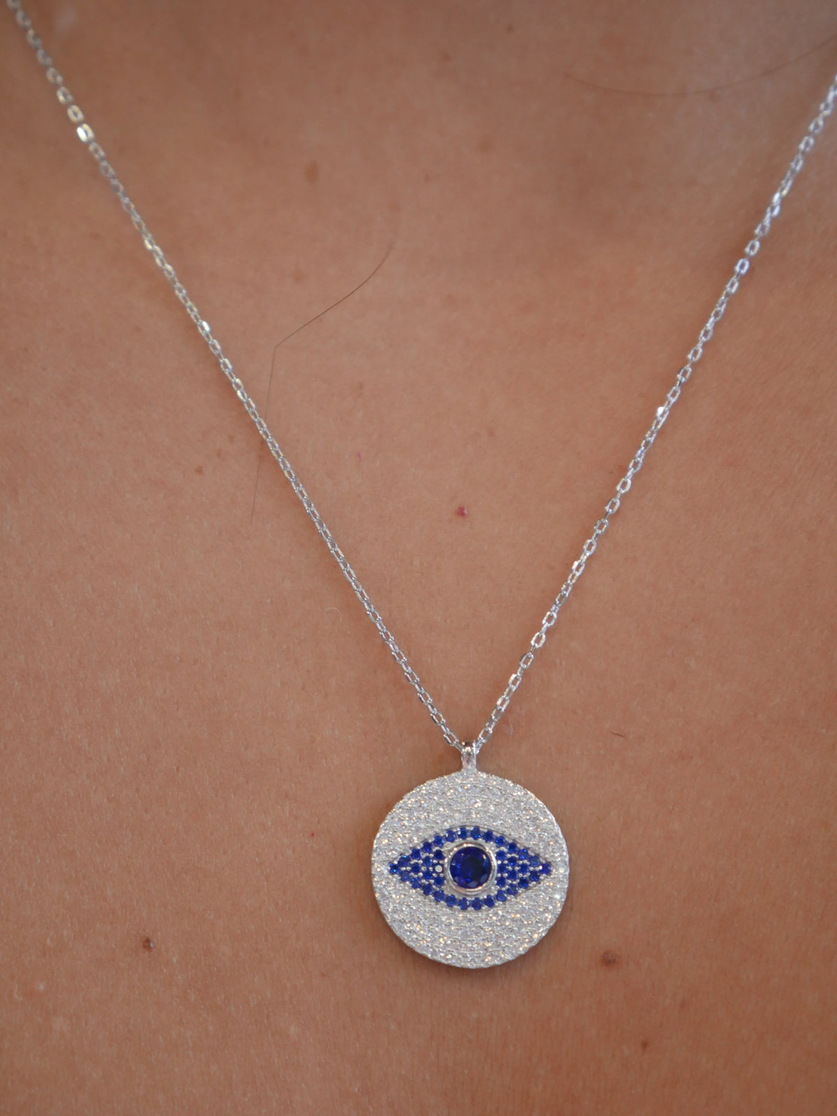 evil eye necklace circle with center navy blue eye diamond cz cubic zirconia rhinestone sterling silver white gold necklace, waterproof, trending unique necklaces for protection. Gift ideas for men and woman, unisex evil eye necklaces, dainty, waterproof Kesley Boutique