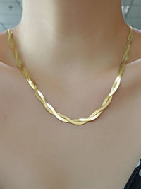 herringbone necklace gold plated .925 sterling silver. short choker necklace gold waterproof. twisted herringbone necklace. braided herringbone necklace for men and woman, 90's necklace gold Kesley Boutique . trending influencer style necklaces. trending accessories of 2023. popular necklaces in 2023. versace inspired necklaces. flat necklace gold. designer inspired gold necklace that wont tarnish or turn green. plain gold necklace. 90s necklaces. 80s necklaces. festival jewelry. Kesley Boutique