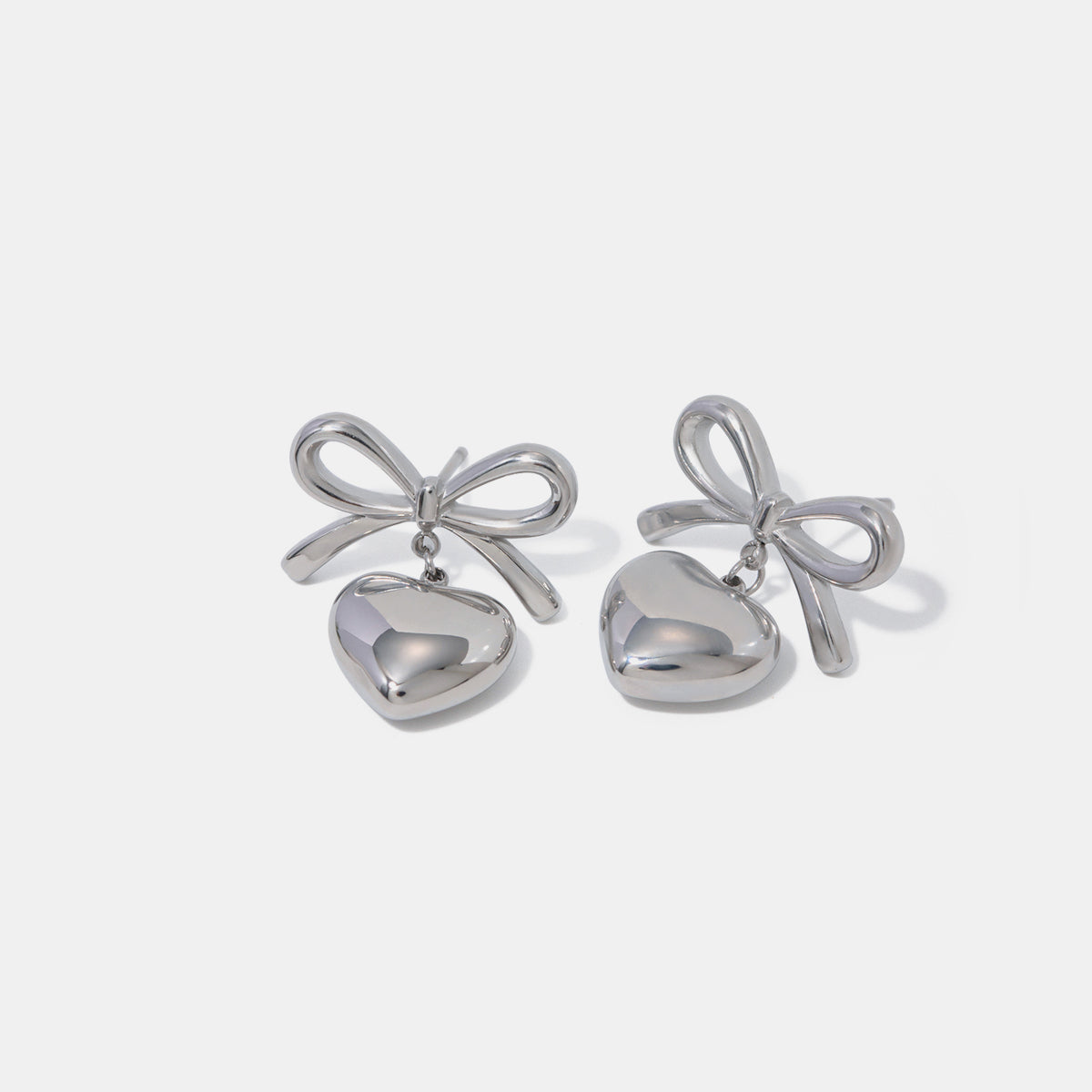 earrings, bow earrings, heart earrings, Heart jewelry, waterproof jewelry, waterproof Earrings, Heart jewelry, heart earrings, tarnish free earrings, tarnish free jewelry, kesley fashion, cheap earrings, affordable jewelry, bow earrings, dangly bow earrings, danlgy waterproof jewelry 