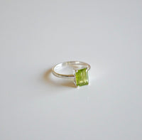 rings, silver rings, Peridot Ring White Gold .925 Sterling Silver Waterproof, dainty. Unique birthstone rings. Shopping in Miami. Jewelry store in Brickell. Jewelry store in Miami.  Green rings. Emerald cut ring. Birthstone rings. Unique, trending. rings, silver rings, jewelry, birthstone jewelry, fine jewelry, nice rings, green gemstone rings , peridot jewelry, august birthstone jewelry